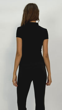 Becca Black Quarter-Zip Short Sleeve Top